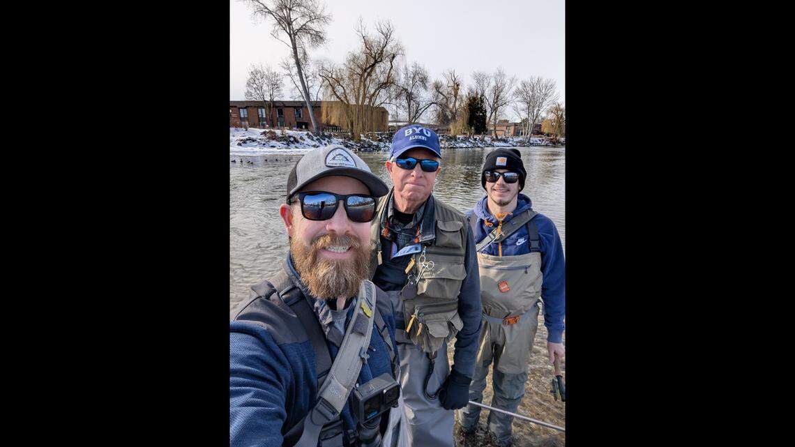 From left: Derrick Hicks, Mike Rotz and Johnathon White stand in the Boise River together, clad in fishing gear. The three men met after Hicks found a fly rod in the river days after Rotz lost it. White saw a post Rotz made about his missing rod, as well as a video Hicks made about his discovery. He connected the two.
