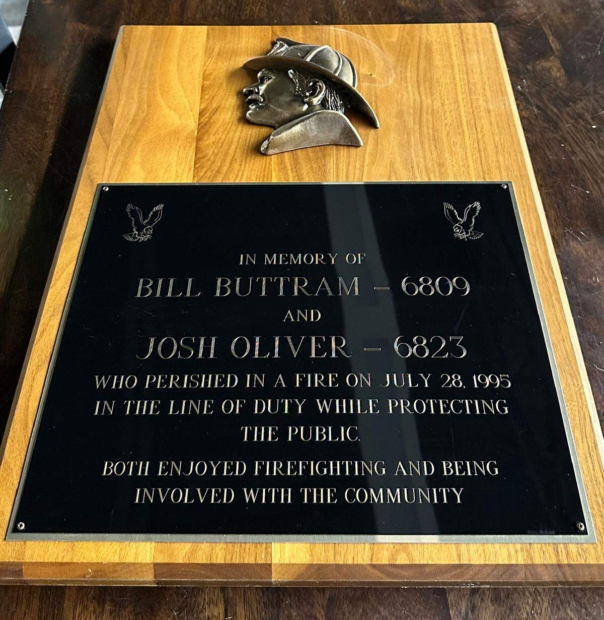 This plaque honoring Kuna firefighters Bill Buttram and Josh Oliver hangs in the front hallway of the Kuna fire station, across from the main entrance, greeting everyone who enters.