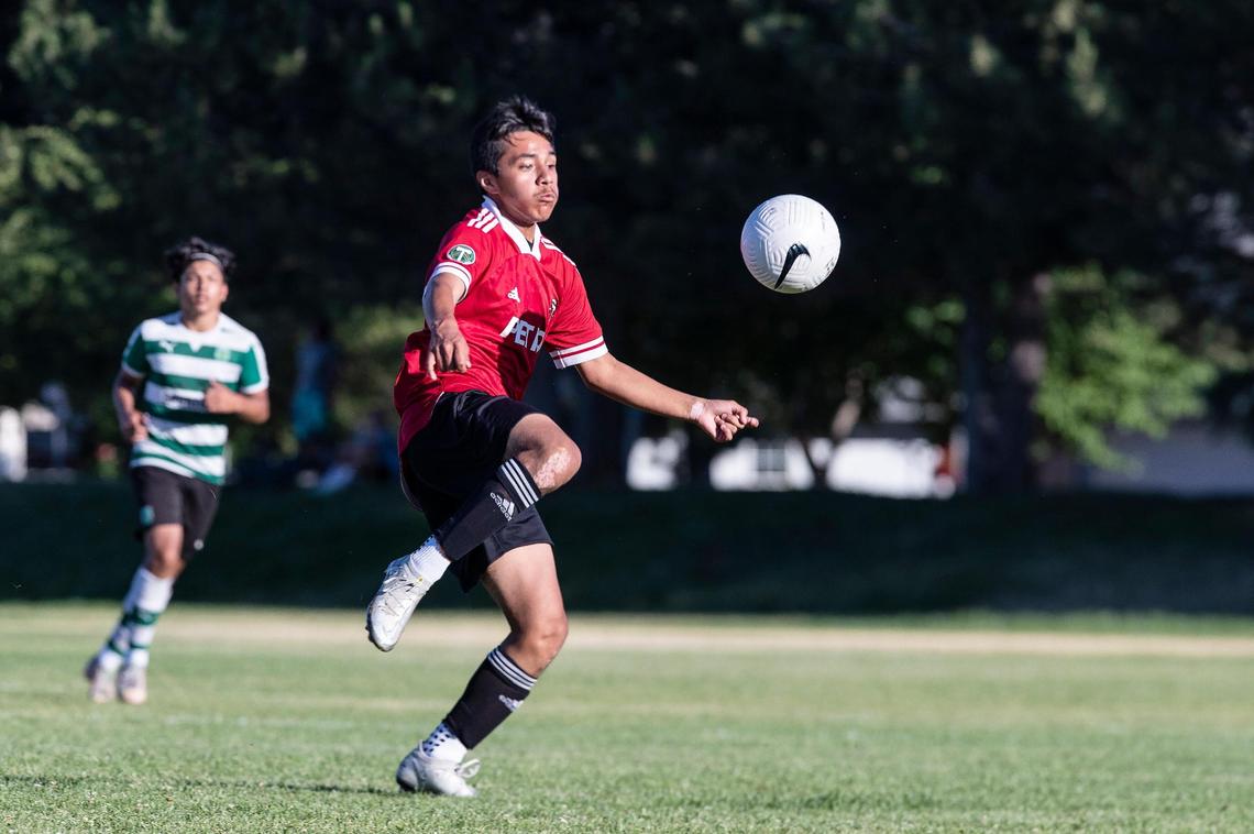 Alan Cisneros Hernandez readies for a bouncing ball during the U-14 Boise Timbers boys’ semifinal matchup against Santa Clara Sporting at the Far West Regionals at Boise’s Simplot Sports Complex.