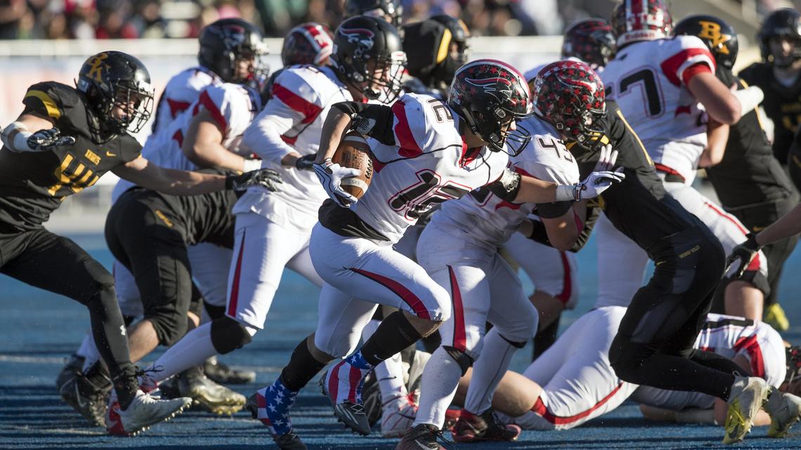 Hillcrest senior Oakley Hussey follows his blockers against Bishop Kelly’s defense during the 4A state football championship Saturday, Nov. 17, 2018 at Albertsons Stadium in Boise.
