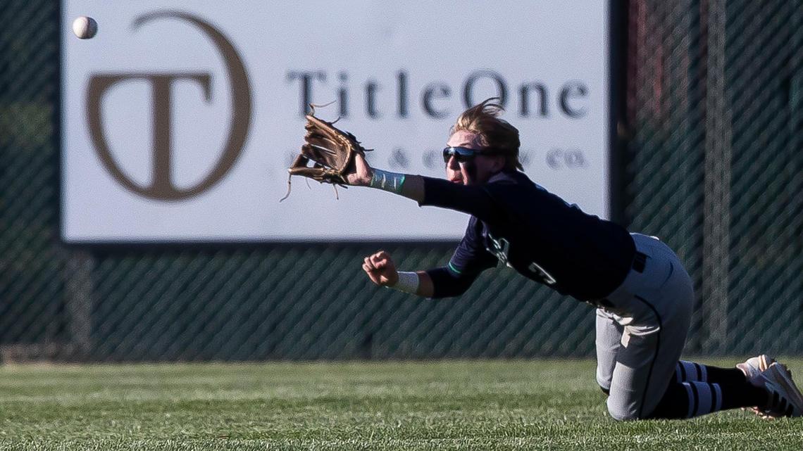 Mountain View center fielder Brody Rasmussen dives and records an out in the bottom of the fifth inning Wednesday at Rocky Mountain.