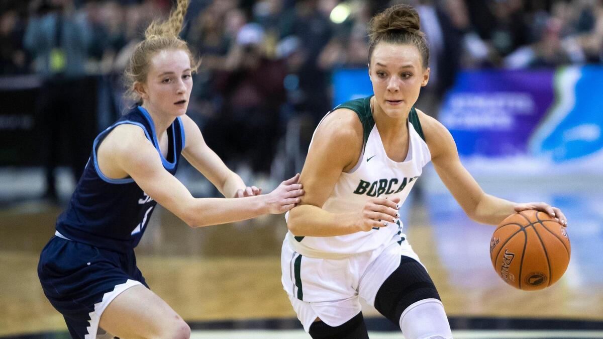 Burley junior Amari Whiting, right, was voted the 4A All-Idaho Player of the Year by the state’s coaches.