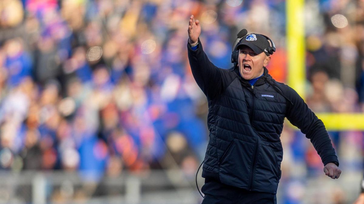 Boise State head coach Spencer Danielson makes the first down sign after a play review in the 1st quarter against Oregon State at Albertsons Stadium in Boise, Friday, Nov. 29, 2024.
