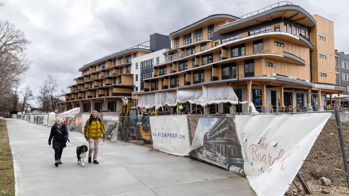 Construction continues Friday on the Boardwalk Apartments along the Boise River in Garden City.
