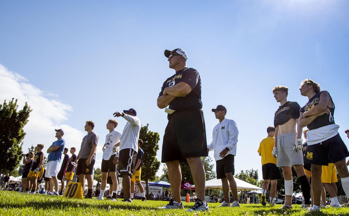 John Zamberlin watches his Meridian Warriors compete in the Famous Idaho Potato Bowl 7-on-7 high school tournament Friday.