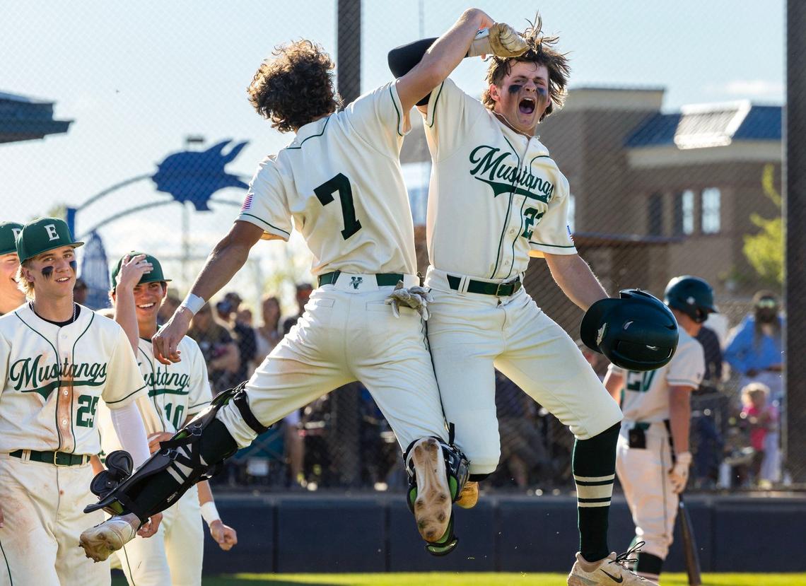 Eagle’s Caleb Zawadzki, right, celebrates a two-run home run during last year’s district championship series.