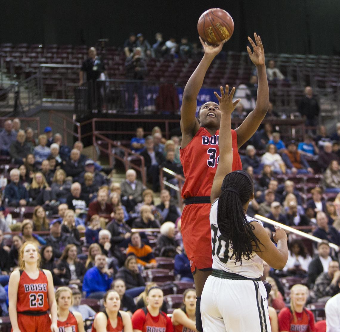 Boise’s Peyton McFarland rises up for jumper over Eagle’s Jaimee McKinnie in the 5A state semifinals last winter.