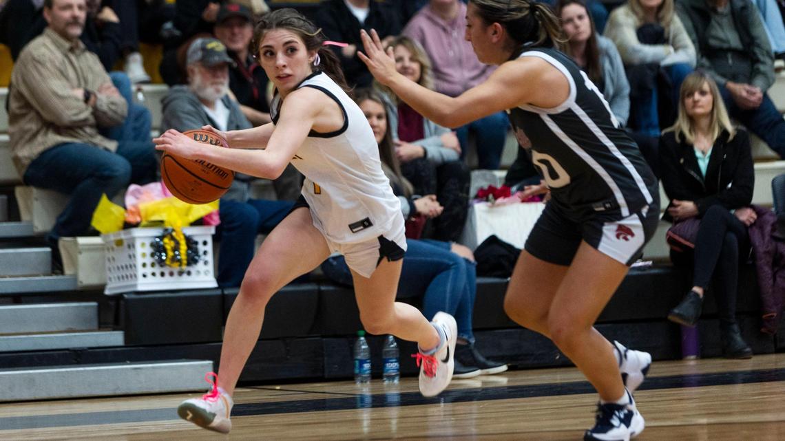 Bishop Kelly guard Jordyn Carnell tries to drive past Columbia’s Violet Soto on Friday.