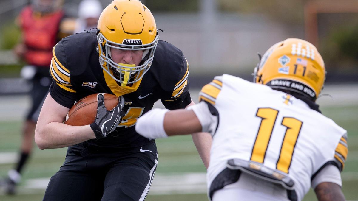 Idaho tight end Alex Moore lowers his shoulder after catching a pass during the Vandals’ annual spring game played in the Treasure Valley on Saturday at Eagle High School.