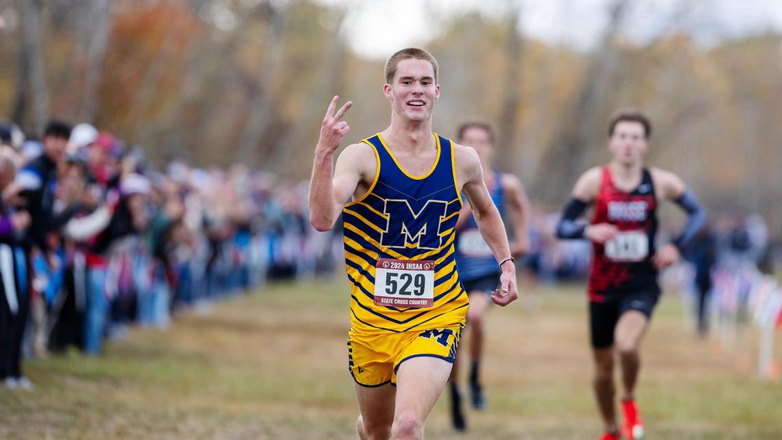 Meridian’s Nate Stadtlander flashes two fingers after winning his second straight state championship Saturday at Eagle Island State Park.