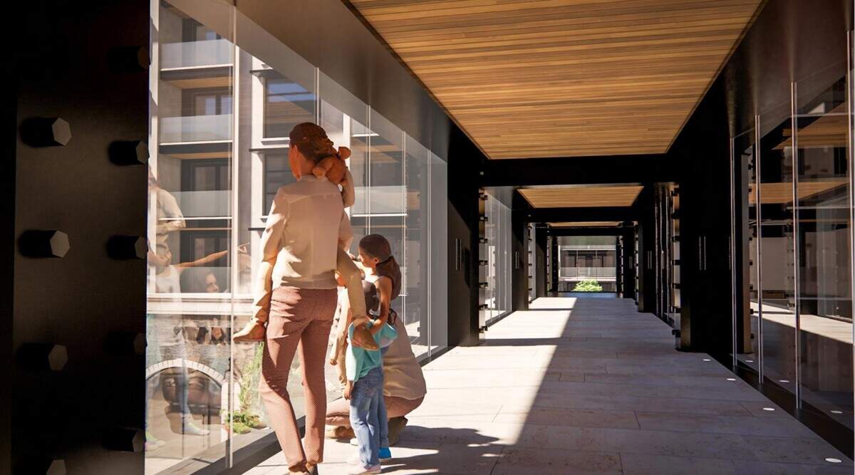 The rendering shows a family looking out of windows along the bridge that would connect two apartment buildings with 530 apartments.