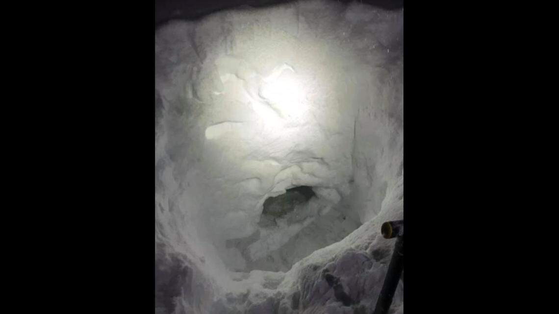 A 17-year-old who became separated from his family while snowmobiling built a snow cave to await rescue in a remote British Columbia wilderness.