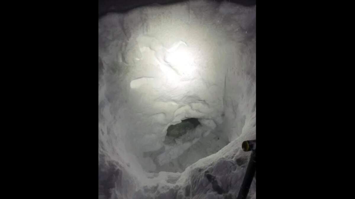 A 17-year-old who became separated from his family while snowmobiling built a snow cave to await rescue in a remote British Columbia wilderness.