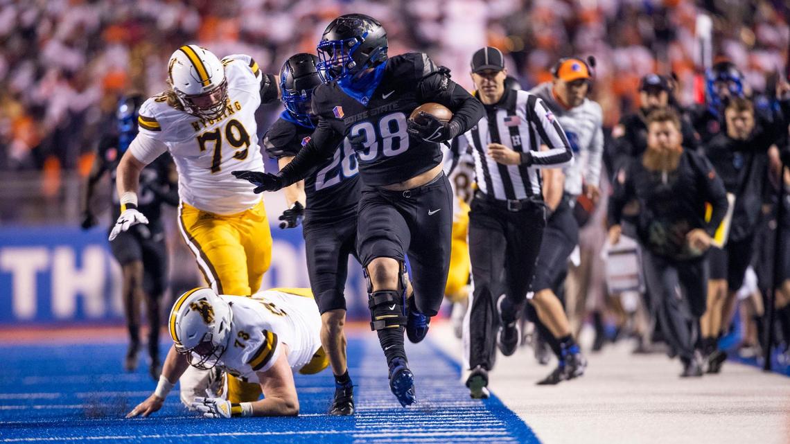 Boise State edge Demitri Washington runs back a Wyoming interception but is pushed out of bounds before getting to the end zone in the 4th quarter Friday, Nov. 12, 2021 at Albertsons Stadium in Boise.