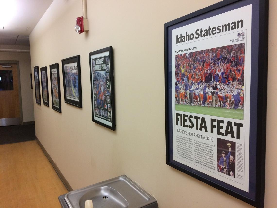 The main corridors inside the Statesman building are lined with past front pages and pictures by the paper’s staff photographers. This section shows a selection of pages featuring Boise State football.