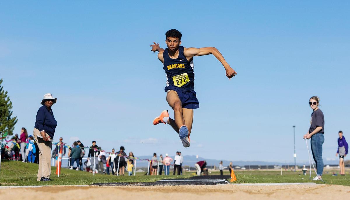 Meridian’s Eli Lawrence competes in the triple jump during the 5A District Three track and field championships held at Kuna High School on Friday.