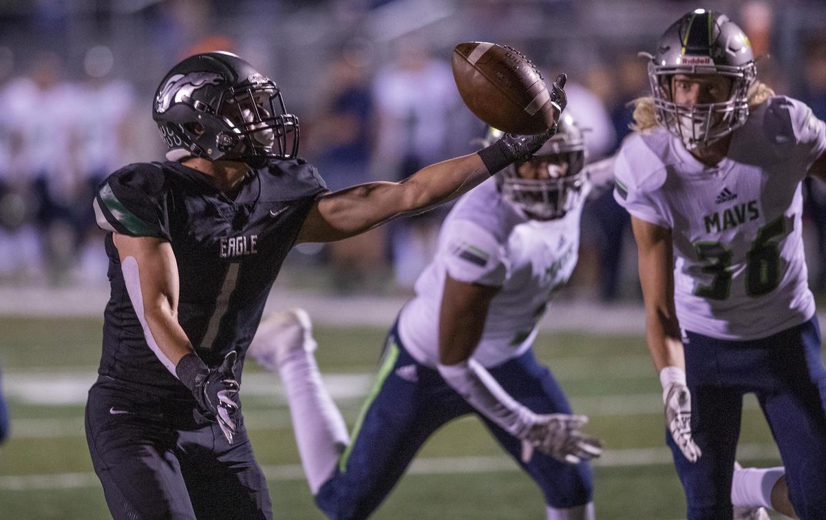 Eagle wide receiver Dalton Mashore hauls in a juggling, 40-yard touchdown catch with 17 seconds left in the first half against Mountain View Friday, Sept. 27, 2019 at Eagle High School.