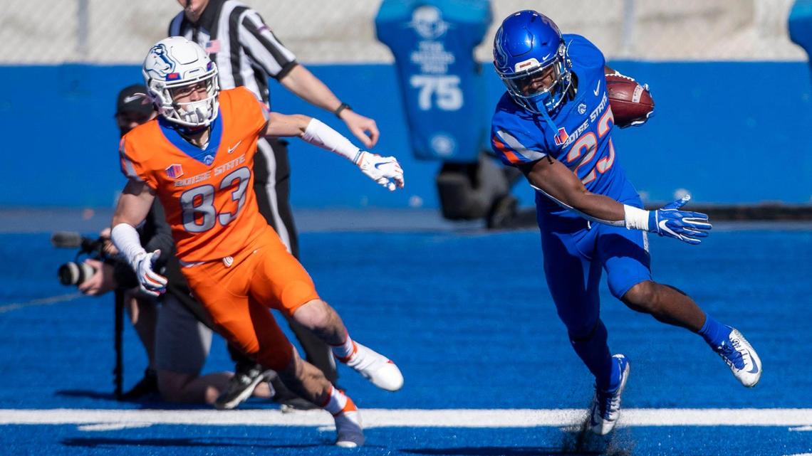 Boise State safety Seyi Oladipo turns to run after intercepting a pass meant for wide receiver Cole Wright during the 2021 spring game Saturday at Albertsons Stadium.