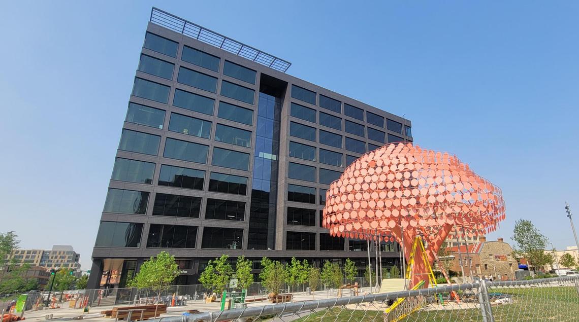 “Gentle Breeze, a 23-foot-high art piece with pink leaves that sway in the wind, has been installed at the nearly completed Cherie Buckner-Webb Park at 11th and Bannock streets in downtown Boise. The newly constructed 11th and Idaho office building is in the background.