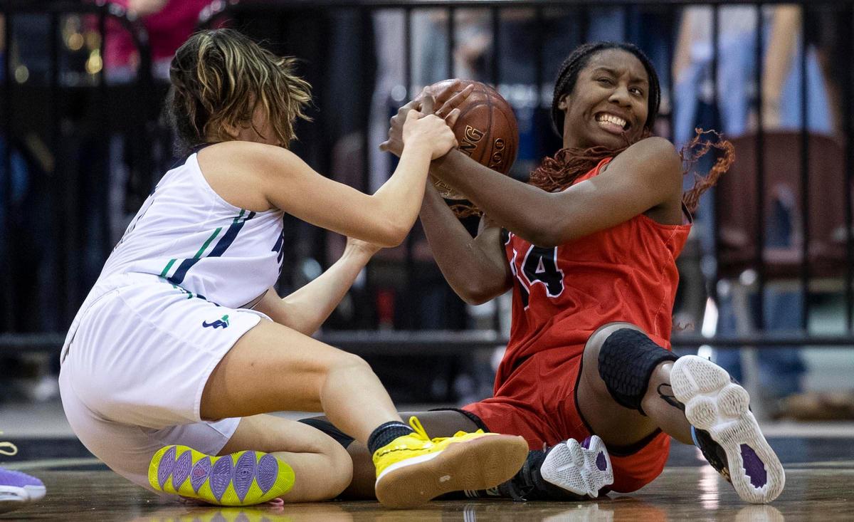 Boise senior Peyton McFarland fights with Mountain View’s Lalla Saenz for the ball during the first round of the 5A state tournament.
