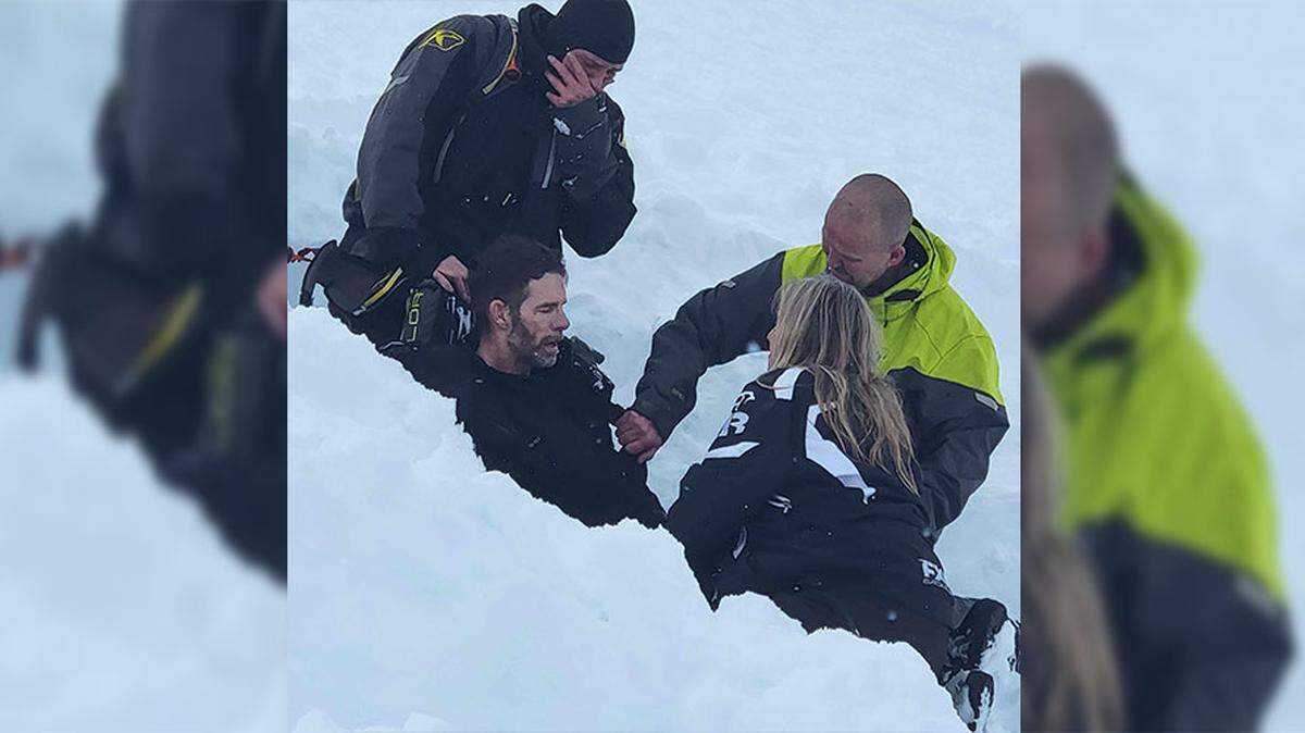 Billy Seibert with his wife Jennifer, Donny Davis (in the green) and Kenny Chapin after Billy survived being caught in an avalanche.