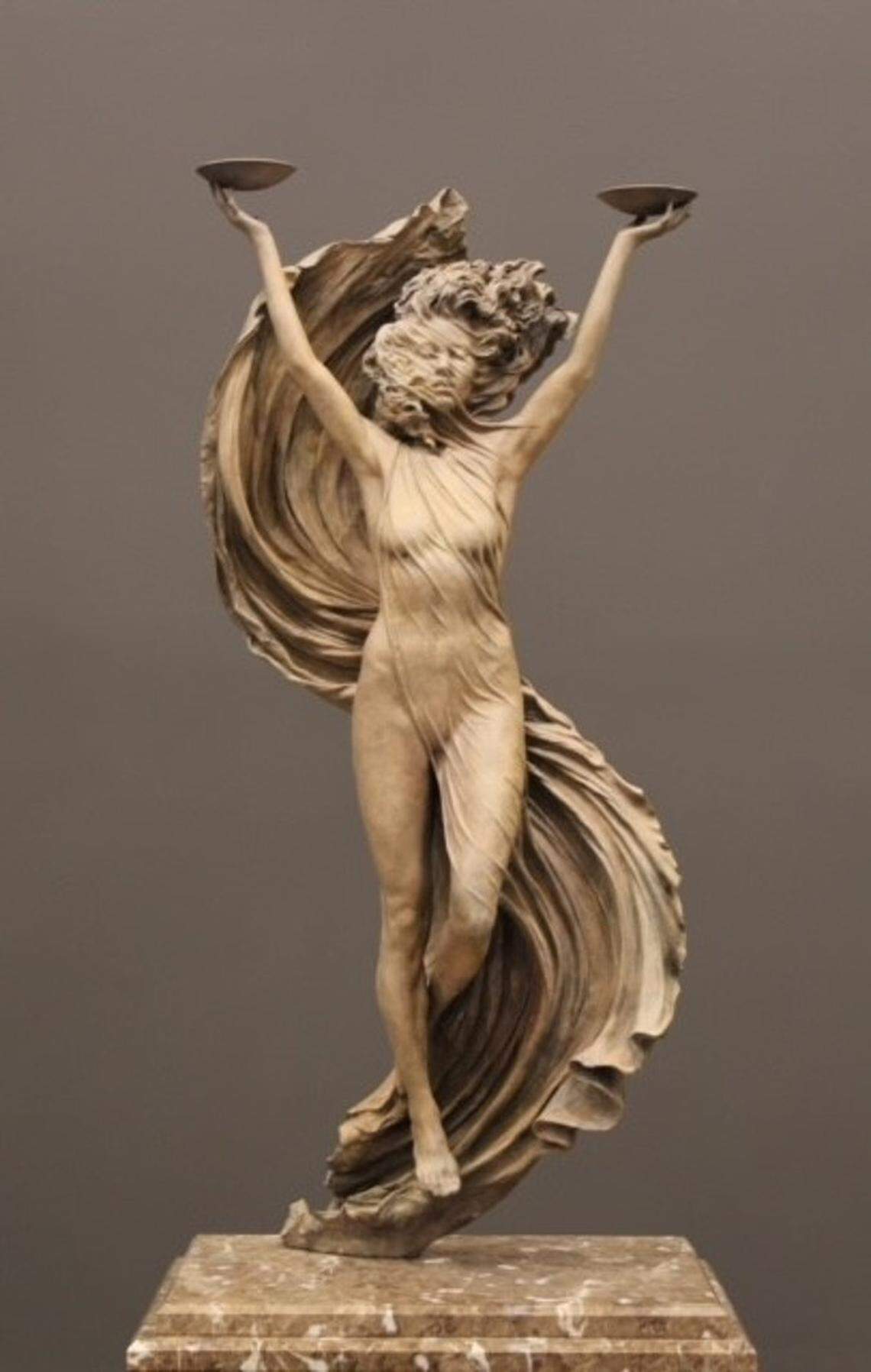 Wassmuth Center for Human Rights leaders commissioned an art piece to represent the scales of justice.