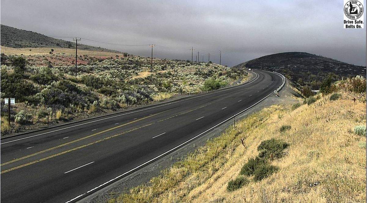 The Idaho Transportation Department’s cameras on Friday morning captured a section of U.S. Highway 95, near Midvale,  that is closed due to a wildfire. In the background, the hillside is seen charred.