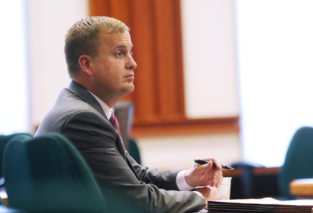 Former Idaho state Rep. Aaron von Ehlinger takes notes during the opening day of testimony in his rape trial at the Ada County Courthouse, Tuesday, April 26, 2022. He has requested for his case be acquitted or retried.