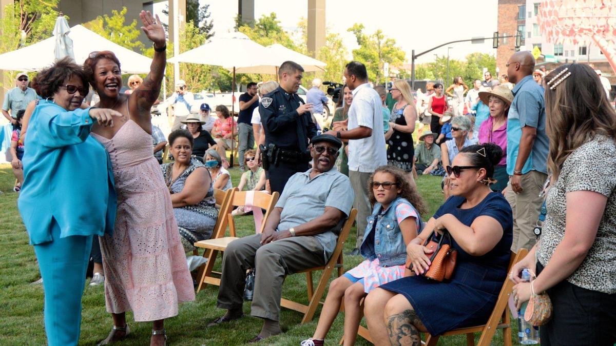 Cherie Buckner-Webb, left, greets family and friends as Boise celebrates the human rights champion by naming its newest urban park in her honor.