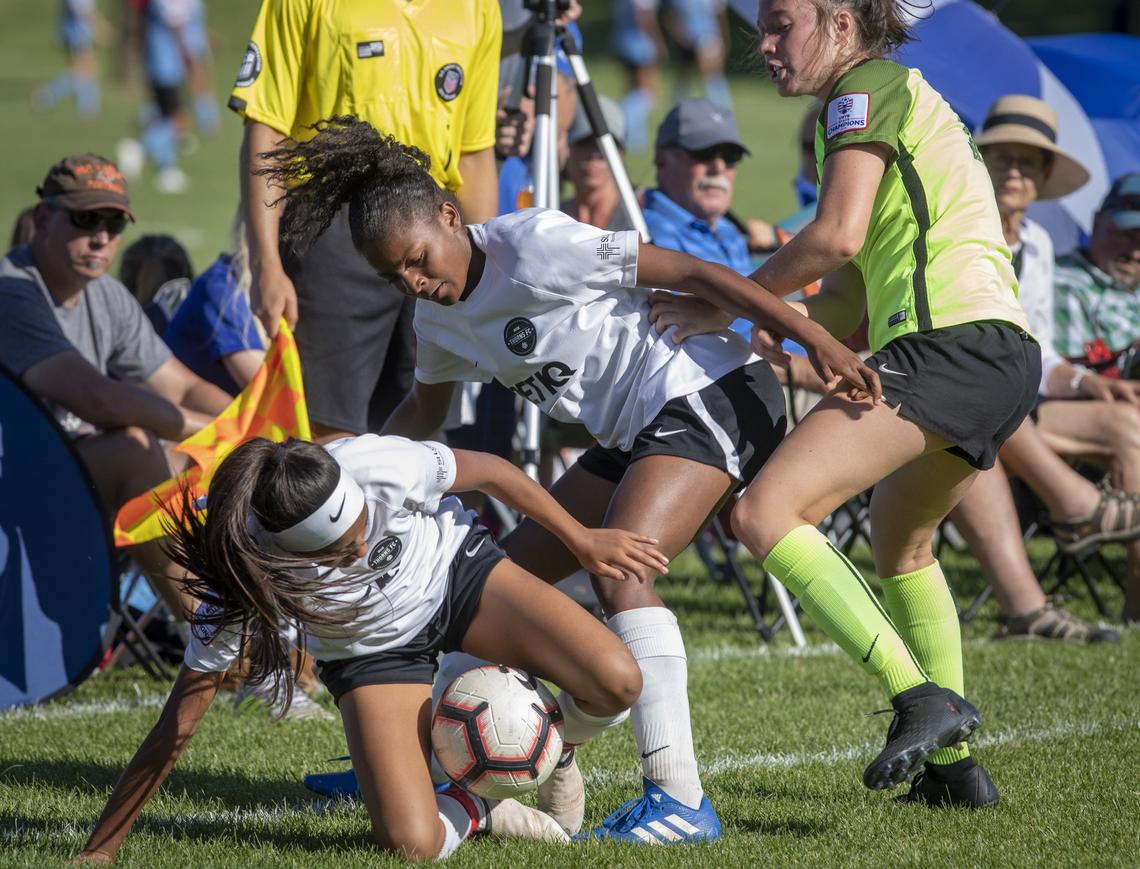 Asia Lawyer, center, and teammate Alondra Osuna try to get control of the ball in the Far West Regional Soccer Championships. Lawyer plays for the U-14 Boise Thorns girls. She is the daughter of former Boise State track star David Lawyer, a three-time Big Sky champ. She’s also the niece of a Boise State track and football player Kerry Lawyer.