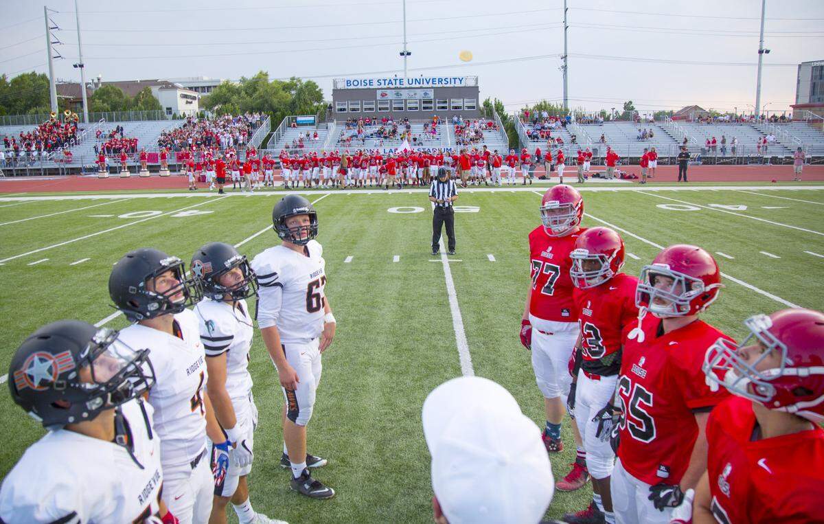 Boise’s four high schools share Dona Larsen Park in Downtown Boise for their varsity football games. Above, the pregame coin toss kicks off a 2017 game between Boise and Ridgevue.