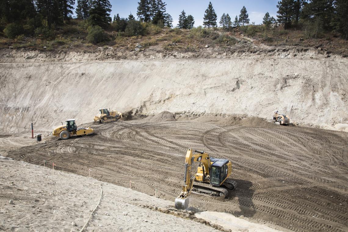 Construction has begun on a dam that will collect water from Bogus Creek for snowmaking. The dam, which will be 60 feet high, will come nearly to the top of the excavated dirt. The Nordic lower loop trail system is on top of the ridge in the photo.