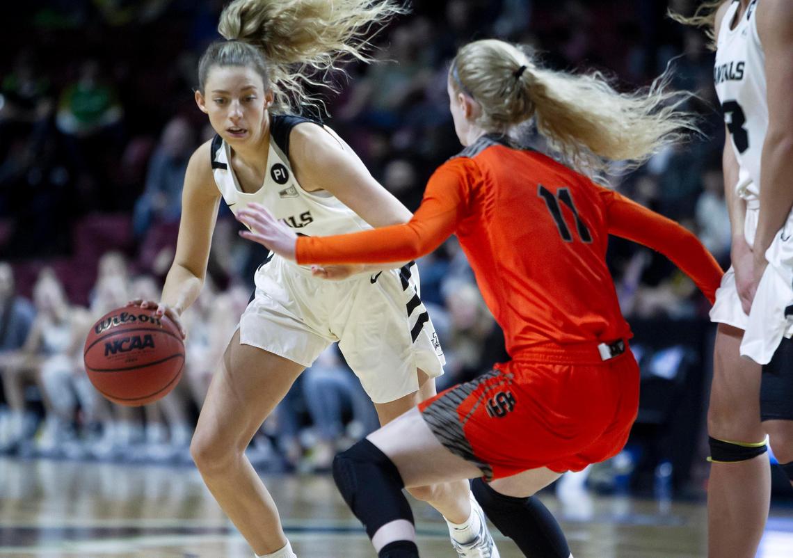 Idaho guard Janie King drives on Idaho State guard Carsyn Boswell in the semifinals of the Big Sky women’s basketball tournament Wednesday at CenturyLink Arena in Boise.