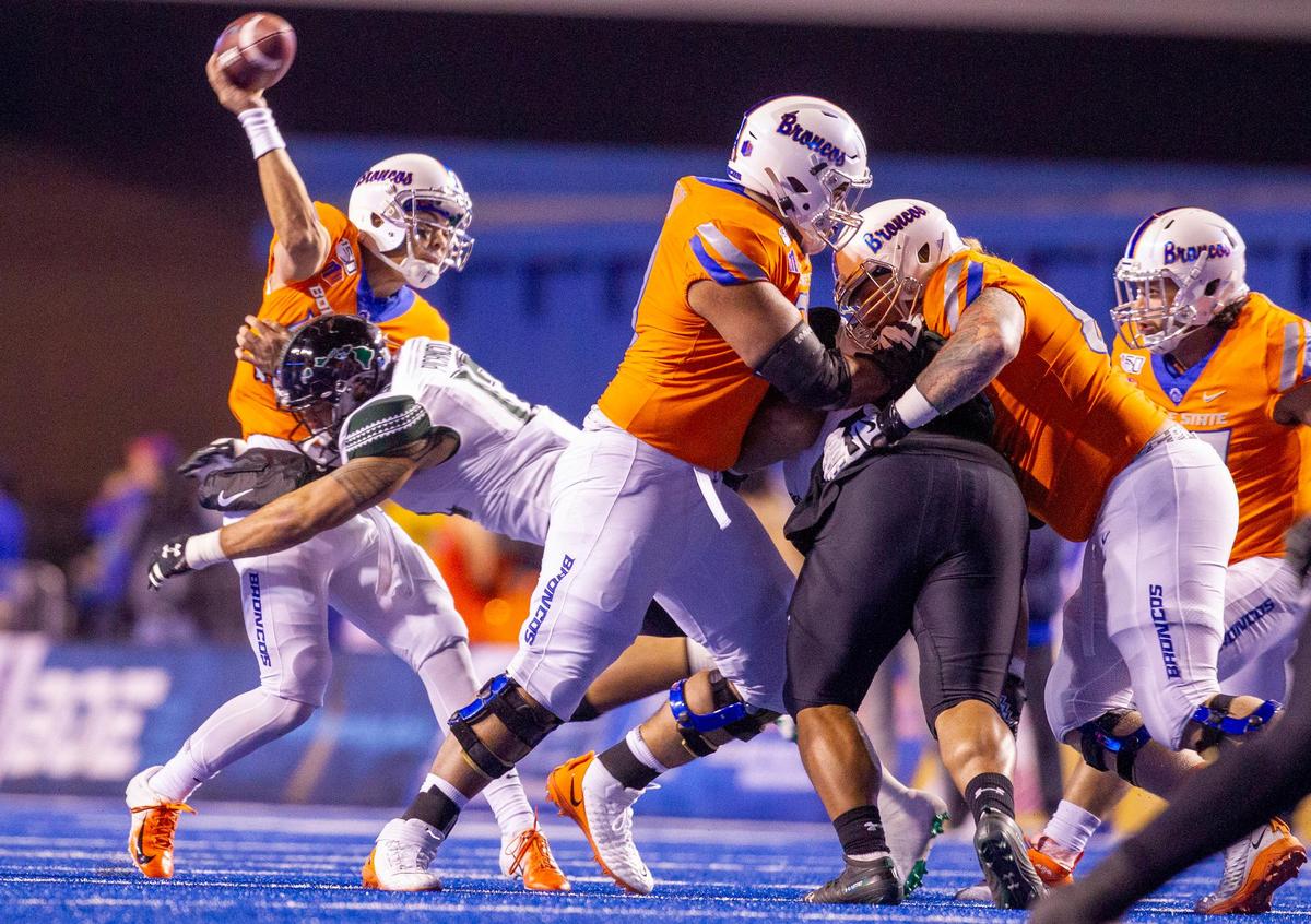 Boise State quarterback Hank Bachmeier gets hit by Hawaii linebacker Kana’i Picanco as he throws a pass earlier this season at Albertsons Stadium. Hawaii knocked him out of the game with a hip pointer.