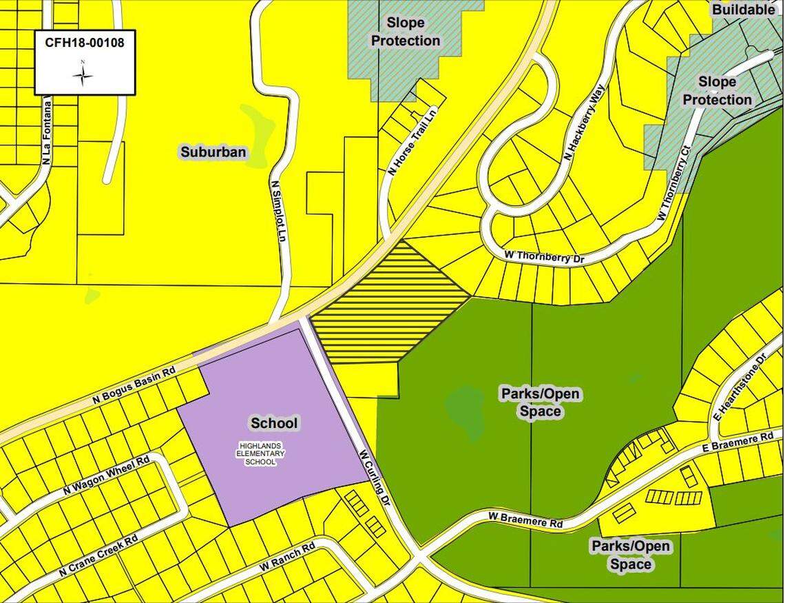 The Highland Heights subdivision would go on the parcel hashed with horizontal lines. A dozen townhouses would face the two adjoining roads, with five detached houses behind them.