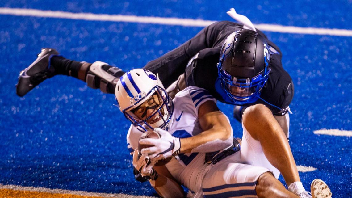 BYU wide receiver Neil Pau’u pushes across the goal line defended by Boise State safety Tyreque Jones (21) to score for the Cougars in the third quarter Friday, Nov. 6, 2020 at Albertsons Stadium in Boise.