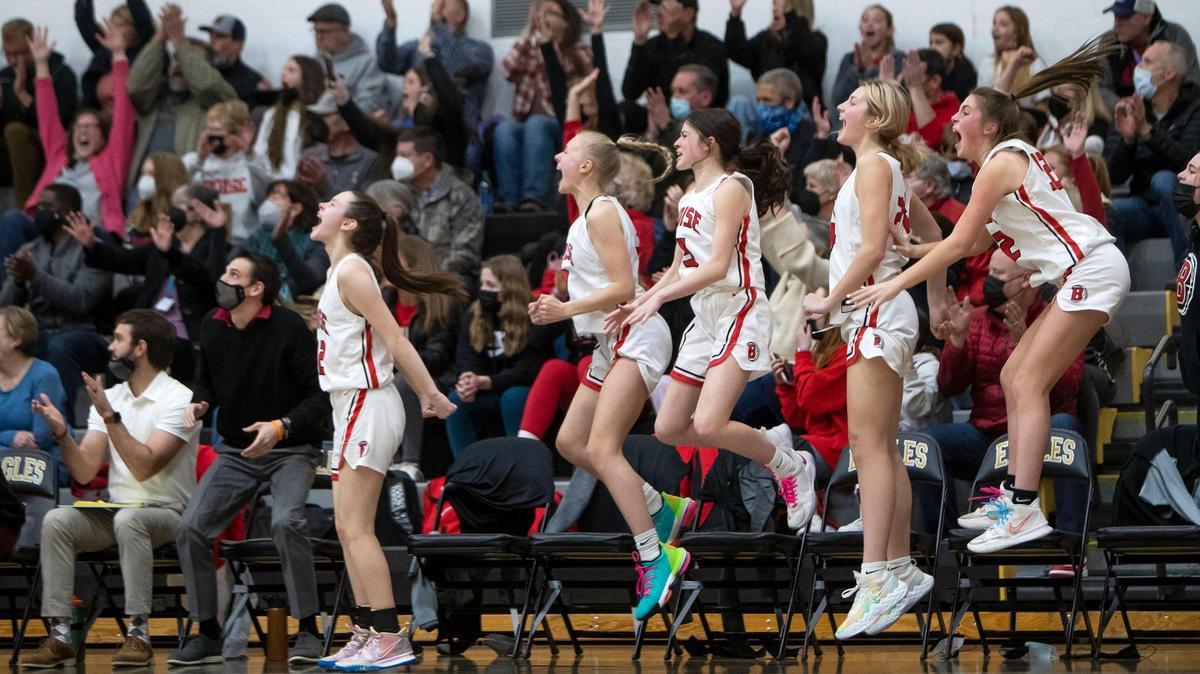 Boise’s bench and fans cheer after a 3-pointer during a 48-30 win over Borah on Saturday that clinched the Brave a spot at the 5A state tournament.