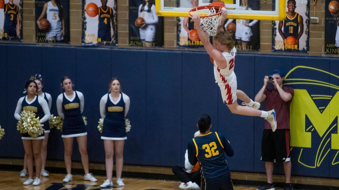 Owyhee guard Jack Payne finishes a dunk against Meridian on Monday. The Storm finished No. 2-ranked team in 5A in the final state media poll.