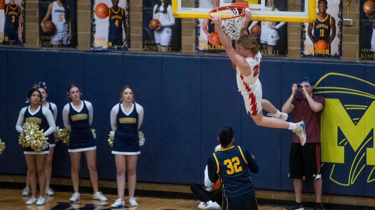 Owyhee guard Jack Payne finishes a dunk against Meridian on Monday. The Storm finished No. 2-ranked team in 5A in the final state media poll.