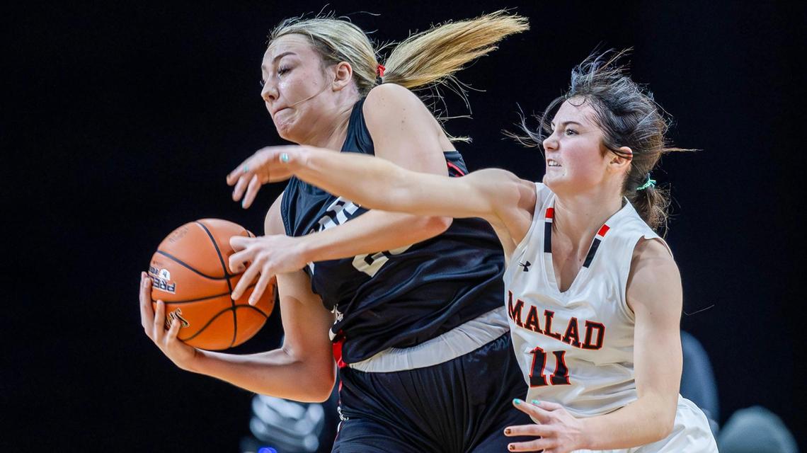 Parma guard Rylie Calkins rips a rebound away from Malad’s Mikell Keetch in the 3A girls basketball state championship game Saturday. Calkins finished with 14 points and six rebounds.