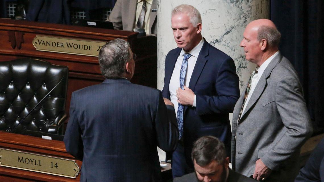 Idaho Assistant Majority Leader Jason A. Monks, R-Meridian, discusses floor business with House Speaker Scott Bedke, R-Oakley and Majority Leader Mike Moyle, R-Star, as the body prepares to debate House Bill 135 Wednesday, April 21, 2021after Gov. Brad Little vetoed the legislation that would curb the Governor’s emergency powers.