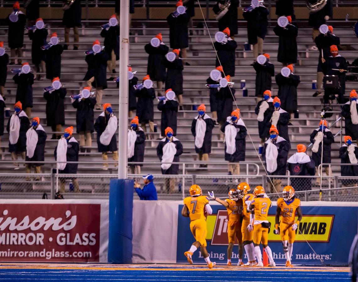 As socially distanced fans watch, Boise State nickel Kekaula Kaniho (28) celebrates his 91-yard run to pay dirt in the game against Colorado State on Nov. 12, 2020 at Albertsons Stadium in Boise. The coronavirus has affected all Boise State athletics.