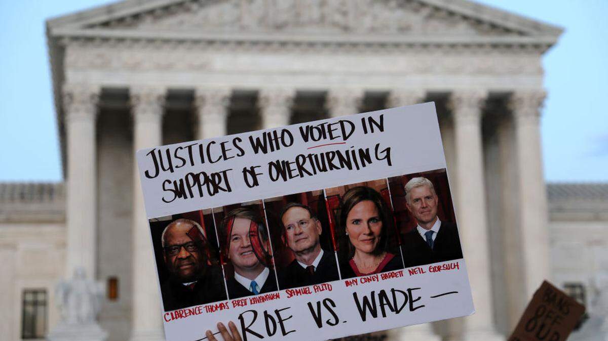 WASHINGTON, DC - MAY 03: A pro-choice activist holds up a sign during a rally in front of the U.S. Supreme Court in response to the leaked Supreme Court draft decision to overturn Roe v. Wade May 3, 2022 in Washington, DC. In a leaked initial draft majority opinion obtained by Politico and authenticated by Chief Justice John Roberts, Supreme Court Justice Samuel Alito wrote that the cases Roe v. Wade and Planned Parenthood of Southeastern Pennsylvania v. Casey should be overturned, which would end federal protection of abortion rights across the country. (Photo by Alex Wong/Getty Images)