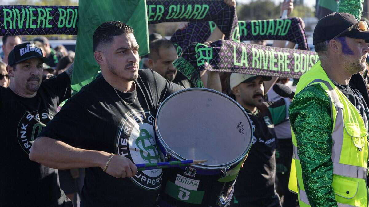 Jonathan Canteros plays a drum with the River Guard, a support fan club for Athletic Club Boise.