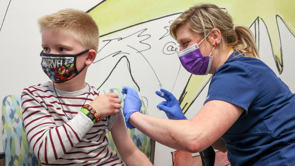 Logan Gates, 8, wasn’t bothered at all as Anne Thomas administered a child dose of the COVID-19 vaccine Nov. 4 at Primary Health Medical Group Pediatrics in Meridian.
