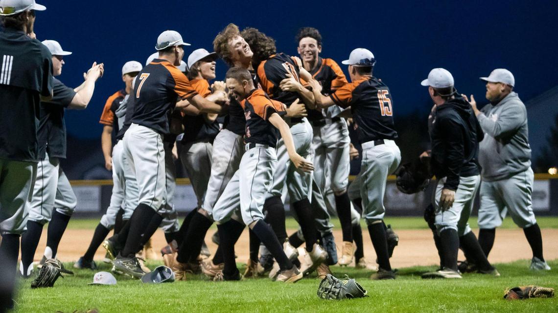 Ridgevue celebrates its first 4A District Three baseball championship Thursday after defeating Bishop Kelly 13-11 at Vallivue High School in Caldwell.