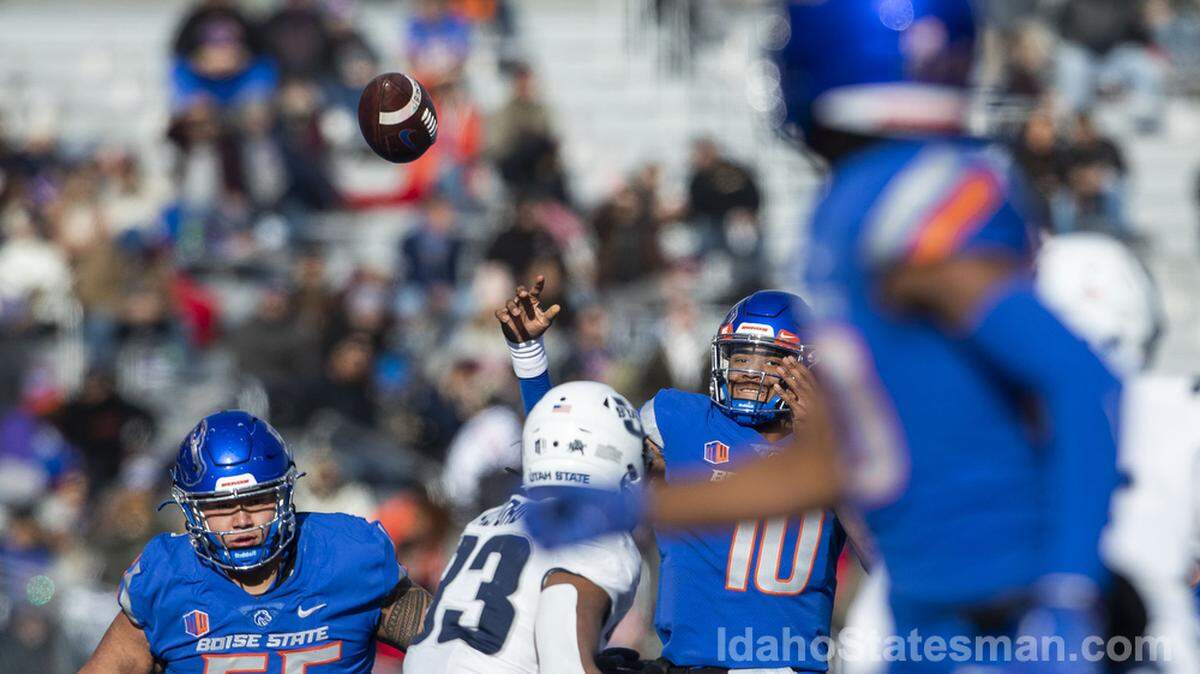 Boise State quarterback Taylen Green throws a touchdown pass to wide receiver Eric McAlister in the first half of the Broncos’ 42-23 win over Utah State on Friday.