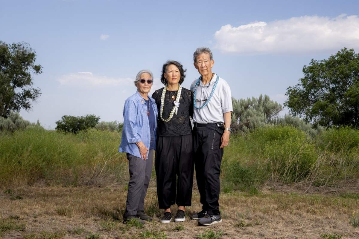 Minidoka Pilgrimage co-chair Erin Shigaki, center, poses with parents Polly Shigaki, left, and John Shigaki, right. John was born at Minidoka, delivered by a horse veterinarian, while Polly, whose parents were matched and married there, was born in Cleveland after they left camp. “I think the pilgrimage is just so important for people to be able to to grapple with the questions that they have...And for it to be a safe place to ask and wonder and have these emotions and and therefore heal,” Erin Shigaki said.