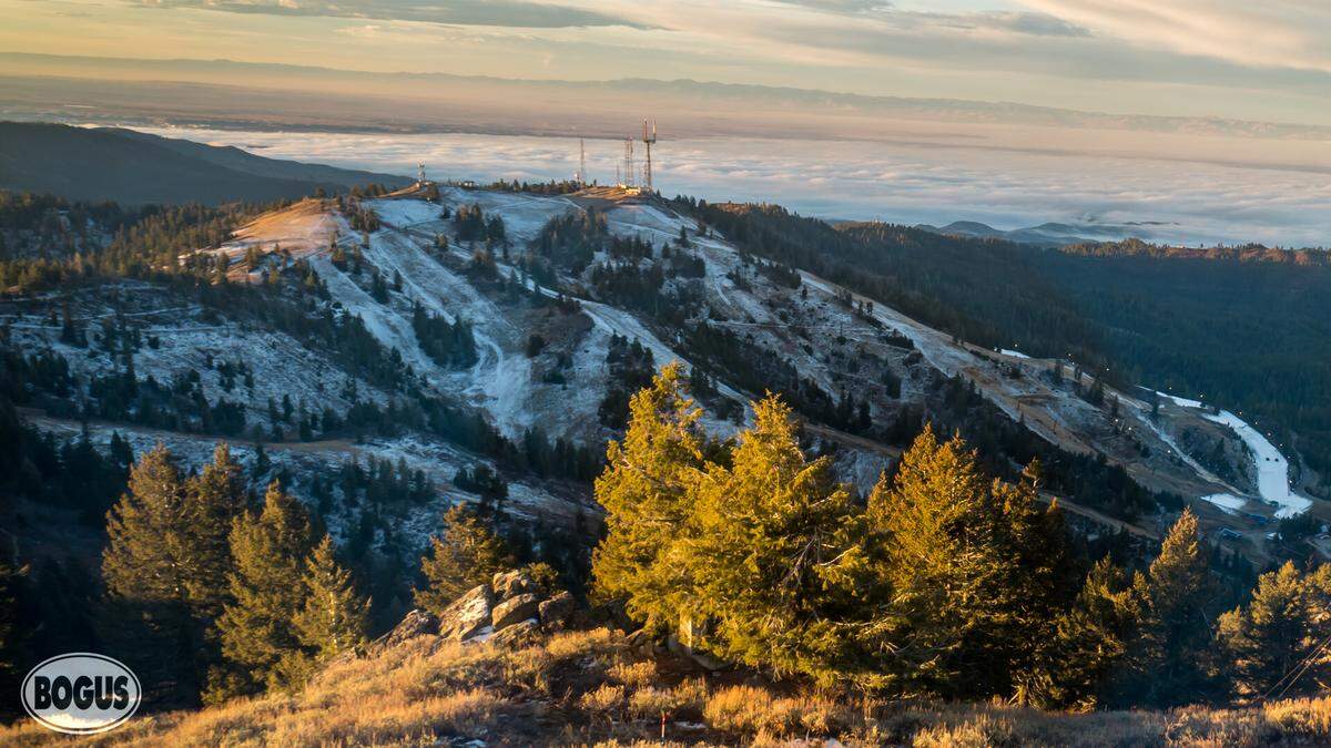 Snow was scant on Bogus Basin on Thursday morning, Nov. 27, except for the lower portion of one run. That run, Coach’s Corner, is visible at bottom right, covered in bright white snow. Thanks to snowmaking efforts, a dusting of snow over Thanksgiving week and new snow-preserving technology, the limited terrain is set to open Saturday, Nov. 29, reportedly the first in Idaho.