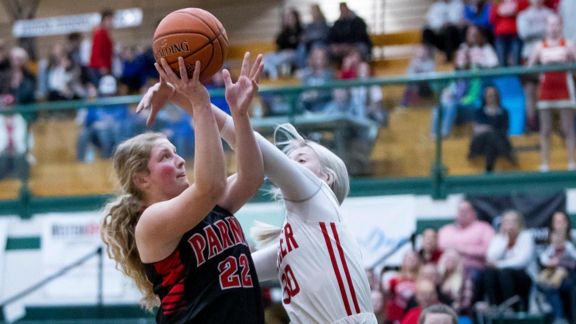 Parma senior Austyn Harris, left, was voted the 3A Snake River Valley Player of the Year by the league’s coaches. scores and draws a foul by Weiser’s Tobie Noyer in the state 3A girls basketball tournament Thursday, Feb. 17, 2022 at Eagle High School.
